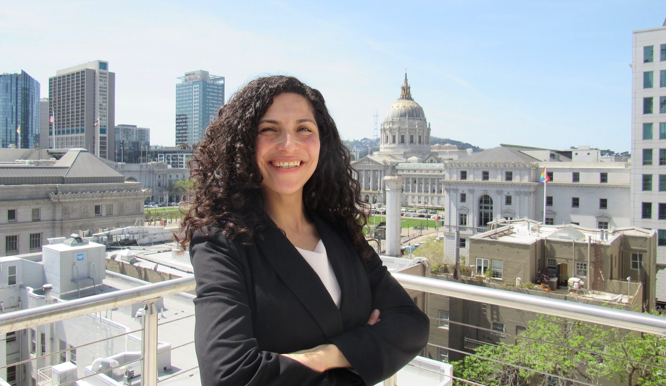 UC Hastings studen Rosamaria Cavalho poses with San Francisco City Hall in the background